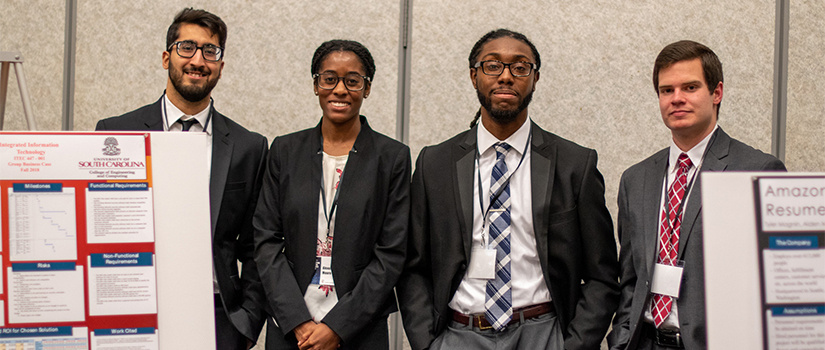 four students present their research at the capstone expo