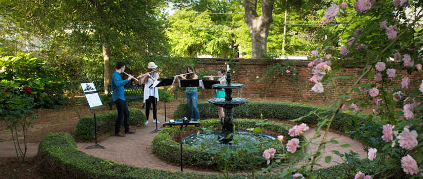 Flute students play in rose garden