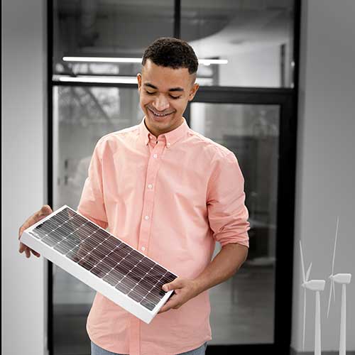 Teen male looks at solar panel